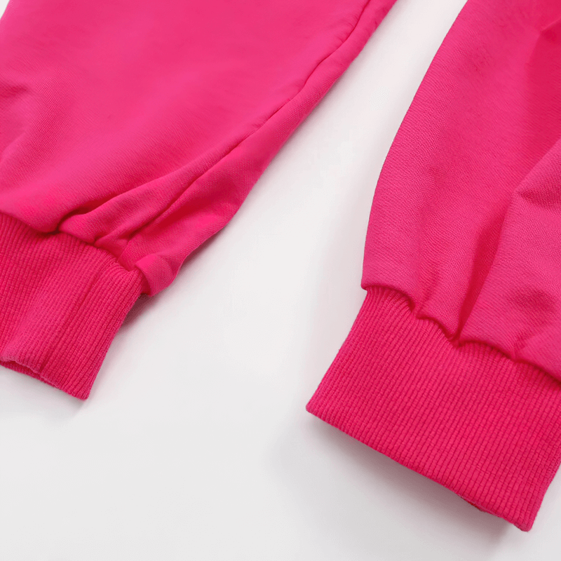 Close-up of bright pink cotton long sleeves from a sports female crop top, highlighting the ribbed cuffs for a stylish and snug fit.